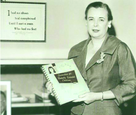 Dr. Gertrude Barber with textbook